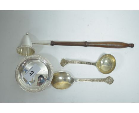 Items of silver in Lindesfarne pattern, comprising: a candle snuffer with turned wooden handle; a preserve spoon; a ladle and