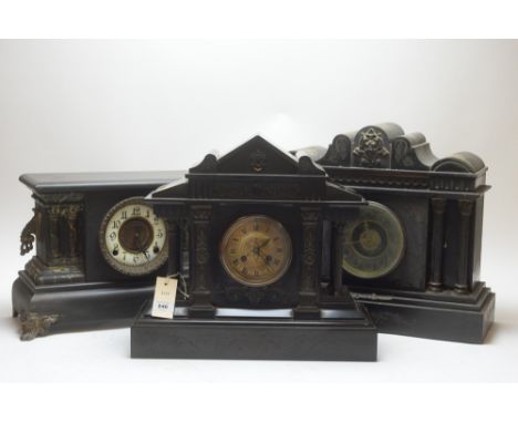 Four French mantel clocks: a slate mantel clock with roman dial marked T.F.Dowell, Carlisle; another slate mantel clock with 