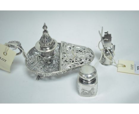 A Dutch silver windmill pattern candle snuffer, with a man on ladders and swivel action; a silver dressing table pot; and a p