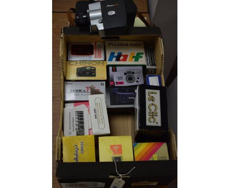 Cameras and ephemera, by: Minolta, Lumicon, Chinon, Polaroid and others, in original boxes.