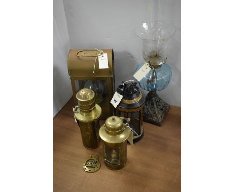 A Victorian oil lamp; together with 19th century brass and other lanterns.