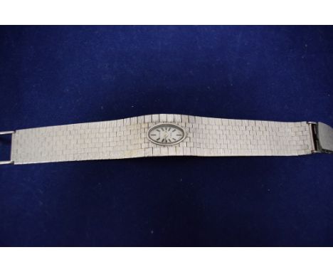 A 9ct. white gold Rotary bracelet/cocktail watch, the oval baton dial fitted manual wind movement on a textured graduated str