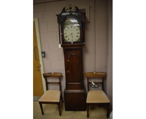 An oak and mahogany banded 30 hour longcase clock in inlaid oak case, the arched painted roman dial inscribed 'Yates, Penrith