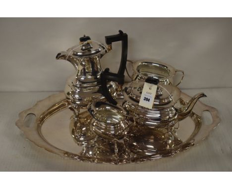 A four piece silver plated tea service, by Walker & Hall, Sheffield, with matching tray.