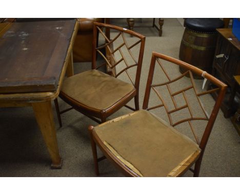 A set of four cockpen pattern Chippendale style dining chairs seats upholstered in distressed material raised on turned legs 