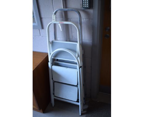 A white painted metal step ladder and an aluminium step ladder.