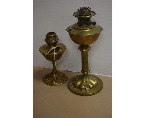 An Art Nouveau cast brass oil lamp signed 'G. Seley' and another Art Nouveau oil lamp.  (2)