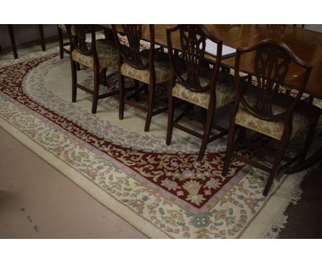 20th Century Indian carpet with foliate design on red and cream ground, 270 x 370cms.