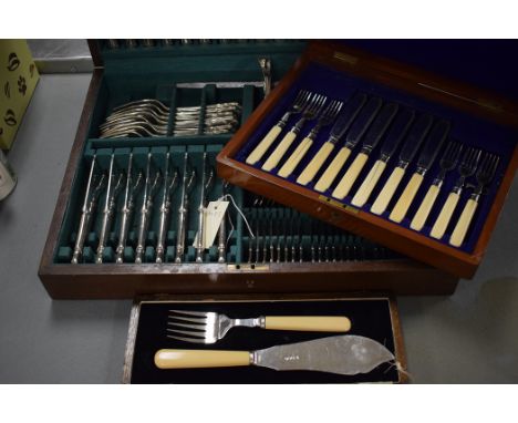 A George V silver fish serving set by Hammond Creake & Co. with ivory handles and fitted case; together with two canteens of 