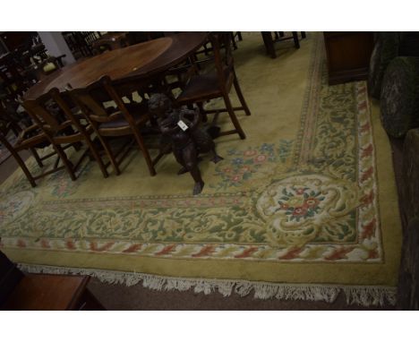 A Chinese carpet with central floral medallion on beige ground; and a modern Chinese rug, foliate design on red and cream gro