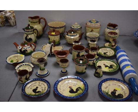 A T.G. Greene Cornish ware blue and white rolling pin; and Torquay ware "Black Cockerel" pattern items, to include: teapots, 