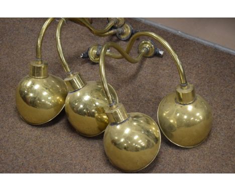 Four modern brass plated wall light fittings with hemispherical shades with white interiors.
