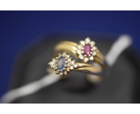 A ruby and diamond cluster ring, on 9ct. yellow gold shank, ring size N; together with a sapphire and diamond cluster ring, 9