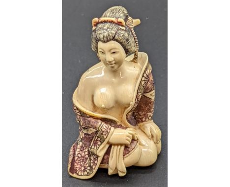 A Japanese Meiji period ivory netsuke of a semi nude lady, signed to base, H.5.5cm