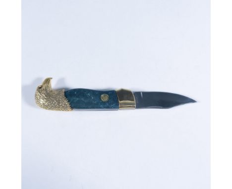 This attractive folding pocketknife features an eagle head design by Ray Beers with a 24k gold-plated bolster and Malachite p