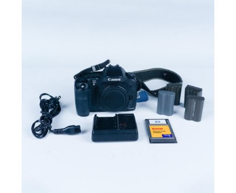 A 6.3-megapixel semi-professional camera. Includes Canon battery charger CB-5L with 4 replaceable batteries, and 1 Kodak Pict