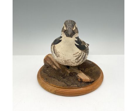 Natural wood carved bird set on round base. Hand painted in brown variations, cream, rust and black. J. Seibert signed. Artis