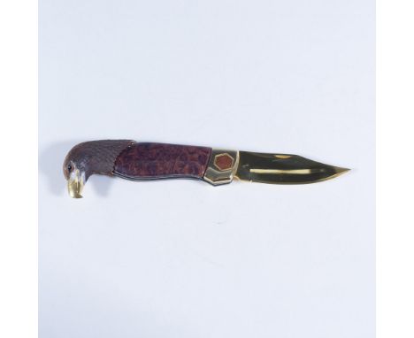 This exquisite folding pocketknife features an eagle head with burl scales design by Ray Beers on a 24k gold-plated frame and