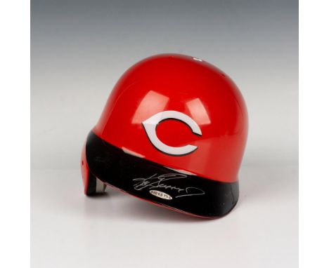 Red batting helmet with Authentic Diamond Collection MLB sticker signed by Ken Griffey Jr in front of an Upper Deck represent