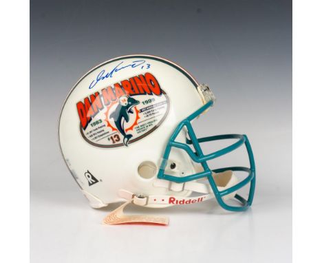 A full-sized Riddell helmet featuring Dan Marino's retirement stats and the Dolphins logo. Hand-signed by Dan Marino and cert