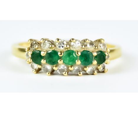 An Emerald and Diamond Ring, Modern, 18ct gold, set with five small emerald stones,  approximately .50ct total, surrounded by