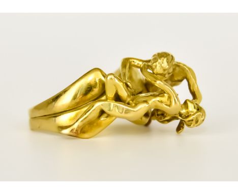 An 18ct Gold Lovers Ring, Modern, depicting a couple in a rapturous pose, size L, gross weight 12.1g