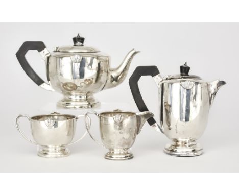 A George VI Harlequin Silver Circular Four Piece Tea Service, by A. Wilcox, Birmingham, 1945, and G. Bryan &amp; Co., Birming