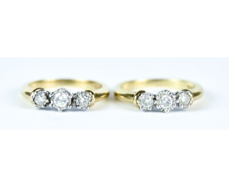 Two Three Stone Diamond Rings, Modern, 9ct gold, each set with three brilliant cut diamonds, approximately .75ct total, sizes