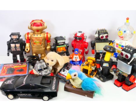 Tomy - Others - A group of unboxed vintage and modern battery operated toys and novelty items, including a Tomy Walking Talki