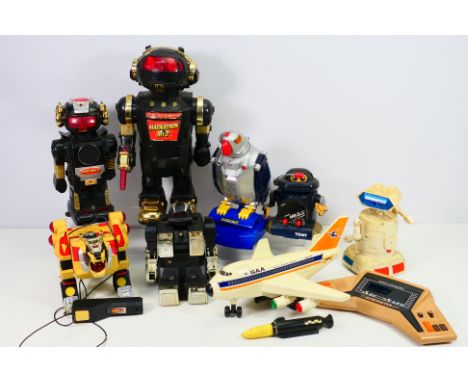 Bandai - Others - An unboxed Bandai Gunfighter hand-held electronic game with a group of plastic battery operated toys and no