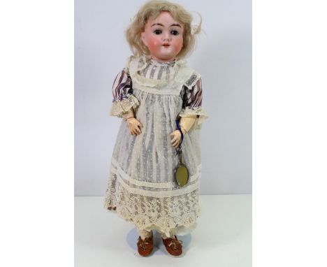 Max Handwerck - A bisque headed German doll carrying a hand mirror, of approximately 46 cm tall, marked 283 / 265 Max Handwer