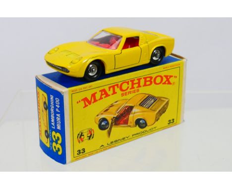 Matchbox - A boxed Matchbox Regular Wheels 33c Lamborghini Miura. The model with yellow body, red interior, chrome hubs, bare