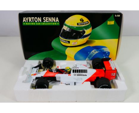 Minichamps - Ayrton Senna Collection - A boxed 1988 McLaren MP4/4 in 1/18 scale # 540881812. The car appears Near Mint in a V