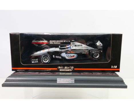 Minichamps - A boxed McLaren Mercedes MP4/14 Mika Hakkinen car # 530991801. The model appears Mint in a Good box with some st