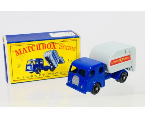 Matchbox - A boxed Matchbox Regular Wheels 15c Dennis Refuse Truck. The model with dark blue cab and chassis with silver trim
