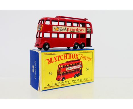 Matchbox - A boxed Matchbox Regular Wheels 56a London Trolley Bus. The model in red, with red trolley poles, gloss black base