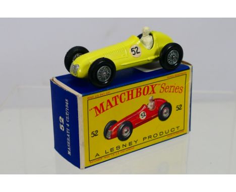 Matchbox - A boxed Matchbox Regular Wheels 52a Maserati 4 CLT. The model with lemon body, black gloss base, wire wheels, RN52