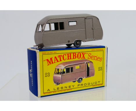 Matchbox - A boxed Matchbox Regular Wheels 23c Bluebird Dauphine Caravan. The model with metallic mauve body and base, 20-tre