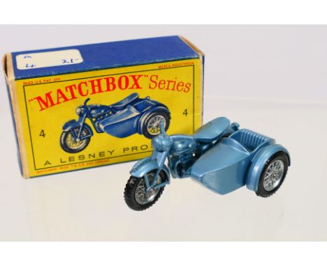 Matchbox - A boxed Matchbox Regular Wheels 4c Triumph T110 Motorcycle. The model in metallic blue, silver spoked wheels and f
