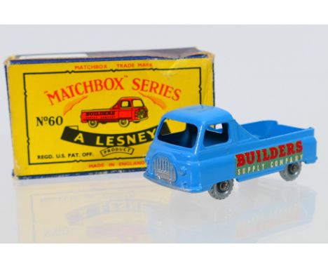 Matchbox - A boxed Matchbox Regular Wheels 60a Morris J2 Pick-Up. The model in light blue, without silver trim to rear, featu