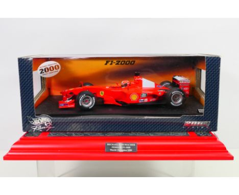 Hot Wheels - A boxed Ferrari F1-2000 Michael Schumacher World Championship car # 26737. The model appears Mint in a Good box 