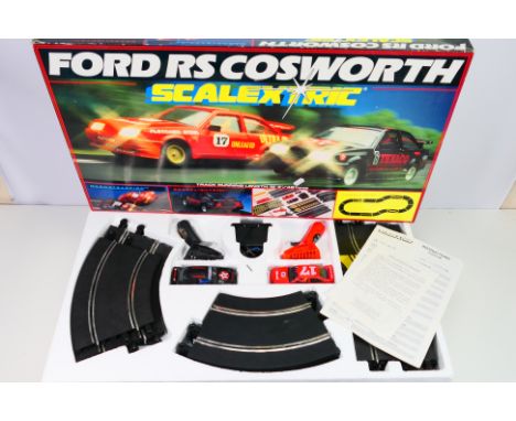 Scalextric - A boxed vintage Scalextric C575 RS Cosworth Racing Set. The cars appear to be missing mirrors but on the whole t