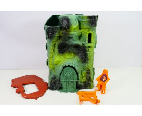 Mattel - A Masters of the Universe Castle Grayskull with a selection of supporting accessories for the castle, including a pl