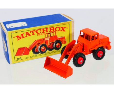 Matchbox - A boxed Matchbox Regular Wheels 69b Hatra Tractor Shovel. The model with orange body, orange shovel without cross 