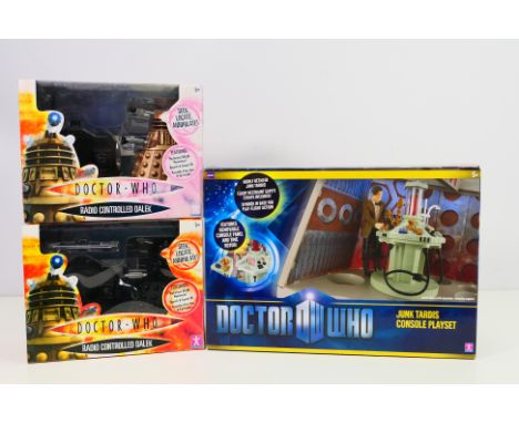 Dr Who - 2 x boxed Radio Controlled Daleks and a boxed Junk Tardis Console Playset. The box for the gold Dalek has been opene