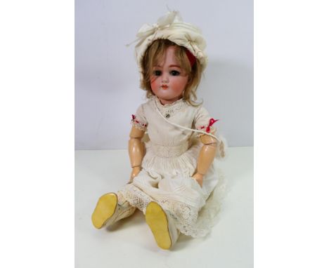 Simon & Halbig - A large bisque headed doll marked SH 1349 Jutta on the back of the head. The doll is approximately 52 cm tal