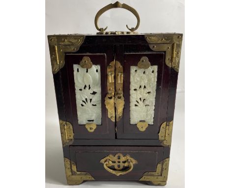 AN EXQUISITE CHINESE JEWELLERY CABINET in the traditional form with two jade panels within the twin doors, with three inner d