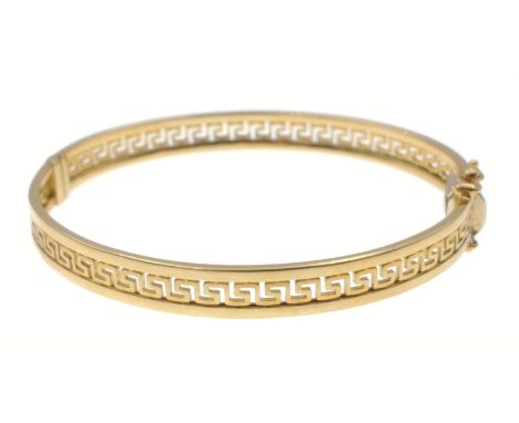 750 stamped yellow gold Greek-Key design 'snap-shut' bangle, diameter 6cm, weight 18.5g approx purchased in Saudi Arabia.Gros