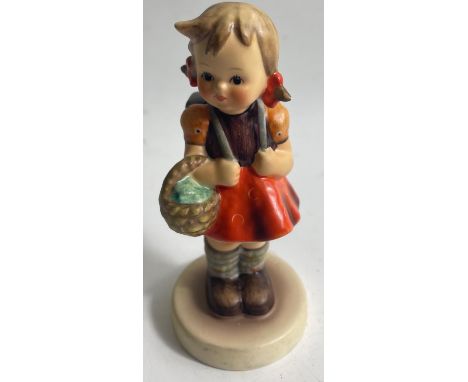 An attractive GOEBEL 'School Girl' figure standing approx. 12cm high