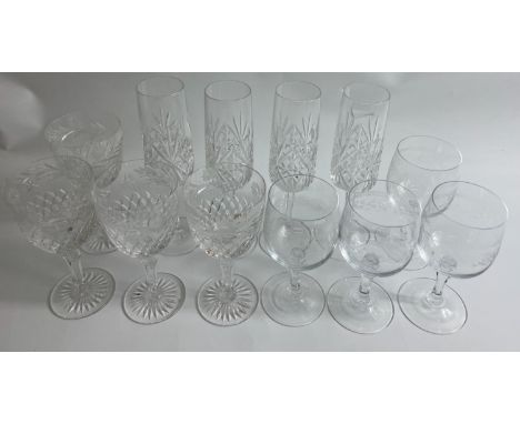 A collection of three sets of glasses, two crystal sets, large wine and champagne flute with four BEAUTIFUL etched GLASSES wi